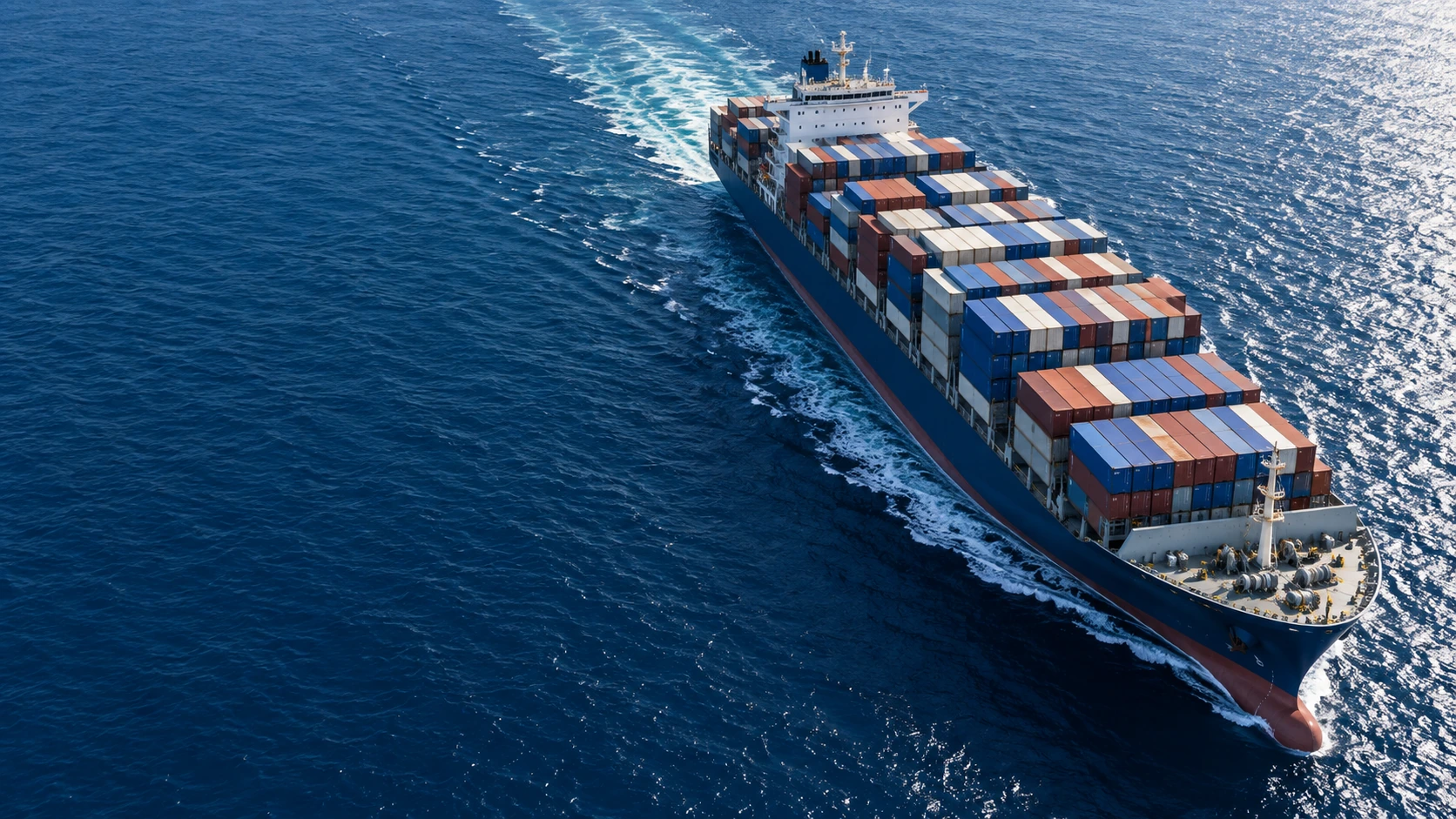 Illustrative aerial view of a container ship at sea
